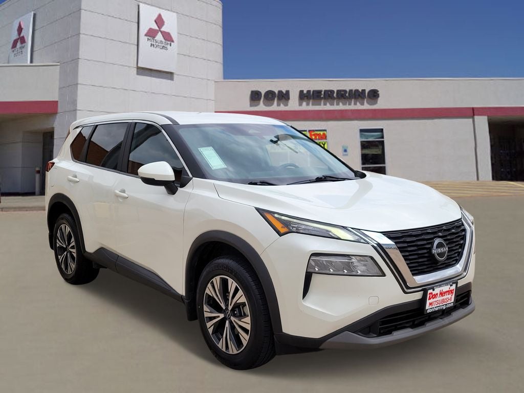 2023 Nissan Rogue SV in Pearl White Tricoat — front three-quarter view