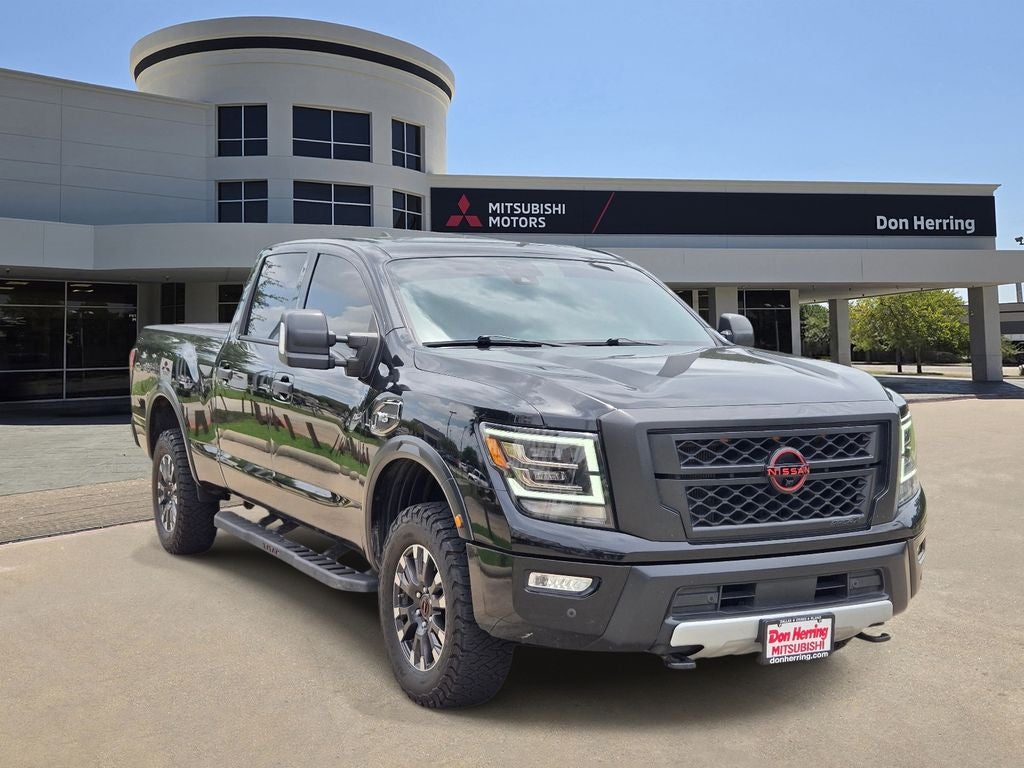 2024 Nissan Titan XD PRO-4X in Super Black — front three-quarter view