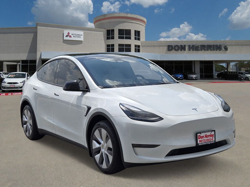 2024 Tesla Model Y Long Range in Pearl White Multi-Coat — front three-quarter view